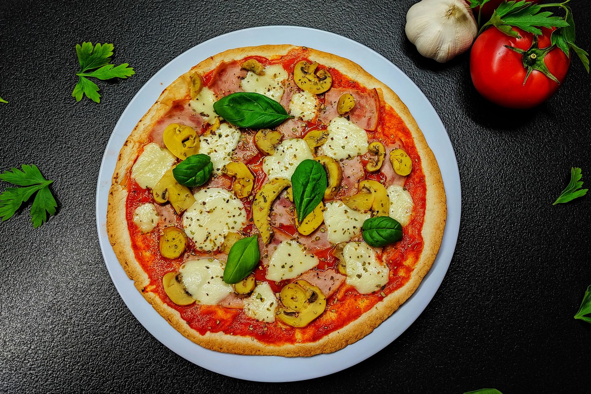 Crisp air fryer mini pizza for one topped with cheese, mushrooms, and fresh basil.