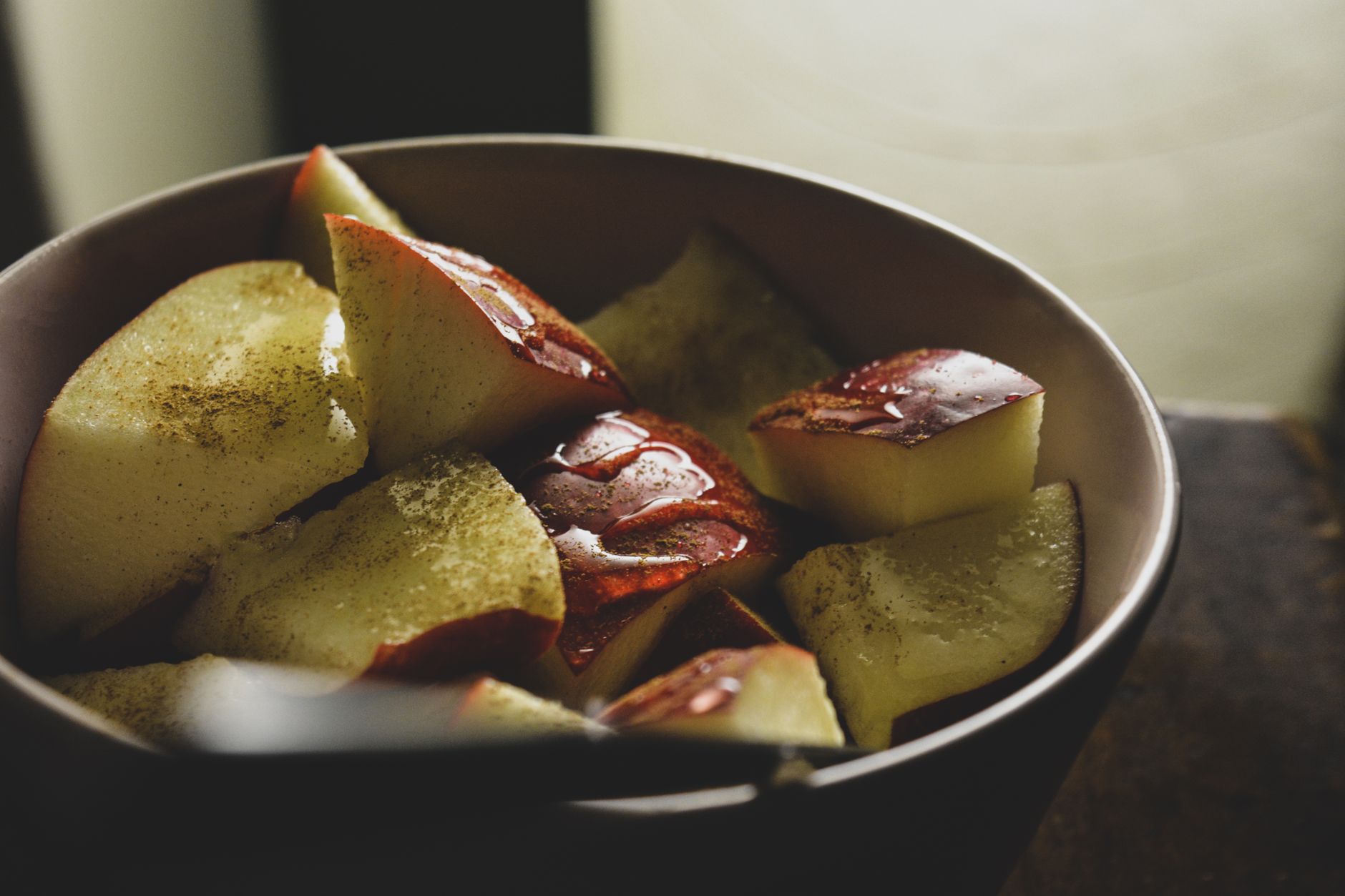 Chopped cinnamon apples for air fryer apple crisp for one before the oat topping is added.