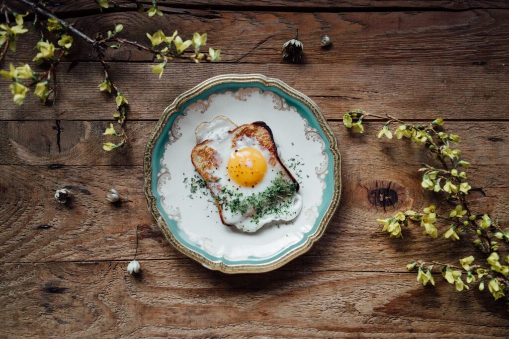 Egg on toast on a patterned plate, shown as breakfast serving inspiration